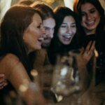 A joyful group of friends enjoying a celebration indoors, sharing laughter and happiness.